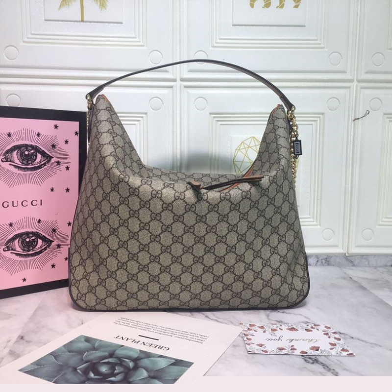 G*u*i top handle bags